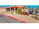 Charming clubhouse with golf cart parking and attractive desert landscaping at 25273 S Berry Brook Dr, Sun Lakes, AZ 85248