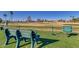 Inviting golf course bench near tee-off area with a scenic course and green bench seating at 25273 S Berry Brook Dr, Sun Lakes, AZ 85248