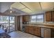 Bright kitchen offering modern amenities, ample counter space, and a lovely view of the patio at 25273 S Berry Brook Dr, Sun Lakes, AZ 85248