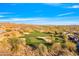 Gorgeous aerial view of a pristine golf course surrounded by desert homes and mountain scenery at 2550 W Pumpkin Ridge Dr, Anthem, AZ 85086