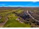Expansive aerial view overlooking the golf course and residential community, showcasing the desert setting at 2550 W Pumpkin Ridge Dr, Anthem, AZ 85086
