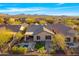 Areal view of house featuring a private pool, fire pit, and desert landscaping at 2550 W Pumpkin Ridge Dr, Anthem, AZ 85086