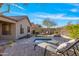 Backyard oasis with a patio, jacuzzi, fire pit, desert plants, and lounge seating at 2550 W Pumpkin Ridge Dr, Anthem, AZ 85086