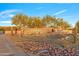Anthem Country Club entrance with desert landscaping, rock features, and attractive signage at 2550 W Pumpkin Ridge Dr, Anthem, AZ 85086