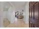 Inviting entryway featuring neutral colors and tile flooring flowing into the living area at 2550 W Pumpkin Ridge Dr, Anthem, AZ 85086