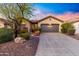 Charming single-story home featuring a well-manicured front yard and a spacious two-car garage at 2550 W Pumpkin Ridge Dr, Anthem, AZ 85086