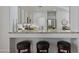 Modern kitchen with granite countertops, breakfast bar with seating, and stainless steel appliances at 2550 W Pumpkin Ridge Dr, Anthem, AZ 85086
