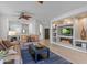 Inviting living room with a cozy fireplace, built-in shelves, and comfortable leather seating at 2550 W Pumpkin Ridge Dr, Anthem, AZ 85086