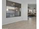 Bright living room area featuring large windows for natural light and tile flooring at 2550 W Pumpkin Ridge Dr, Anthem, AZ 85086