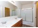 Bathroom featuring double sinks, a framed mirror, and shower with sliding glass door at 2624 E La Costa Dr, Chandler, AZ 85249