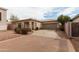 Charming single-story home featuring a two-car garage, brick driveway, and desert landscaping at 2624 E La Costa Dr, Chandler, AZ 85249
