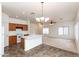 Kitchen featuring oak cabinets, white appliances, and island with sink at 2624 E La Costa Dr, Chandler, AZ 85249