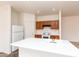 Kitchen showcasing white appliances and a center island with a sink at 2624 E La Costa Dr, Chandler, AZ 85249