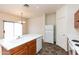 Kitchen area featuring an island, plenty of cabinet space and a pantry at 2624 E La Costa Dr, Chandler, AZ 85249
