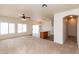 Open-concept living space with carpeted living area and tile kitchen at 2624 E La Costa Dr, Chandler, AZ 85249