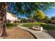 Manicured park featuring a walking path, seating and mature landscaping, offering a relaxing environment at 2624 E La Costa Dr, Chandler, AZ 85249