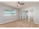 Inviting bedroom with neutral carpet, mirrored closet doors and ceiling fan at 2634 N 52Nd Ave, Phoenix, AZ 85035