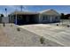 Attractive single-story home with a practical carport, clean lines, and low-maintenance gravel landscaping at 2634 N 52Nd Ave, Phoenix, AZ 85035