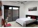 Cozy bedroom with a sliding door to private patio, plush bedding, and minimalist decor creating a relaxing retreat at 29218 N 107Th Way, Scottsdale, AZ 85262
