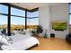 Bright, spacious bedroom with floor-to-ceiling windows and private patio access with desert views at 29218 N 107Th Way, Scottsdale, AZ 85262