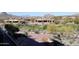 Lush landscaping surrounds this desert home near a golf course, enhancing its natural beauty at 29218 N 107Th Way, Scottsdale, AZ 85262