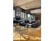 Bright, spacious living room with modern decor, stone accents, large windows, and an open layout for dining and entertaining at 29218 N 107Th Way, Scottsdale, AZ 85262