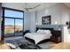 Spacious main bedroom with modern decor, a large window offering scenic views, and stylish furnishings at 29218 N 107Th Way, Scottsdale, AZ 85262