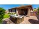 Private backyard featuring a cozy patio, outdoor seating, and ample space at 29374 N 68Th Ln, Peoria, AZ 85383