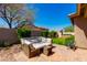 Lush backyard featuring a cozy outdoor seating area, patio, and greenery at 29374 N 68Th Ln, Peoria, AZ 85383
