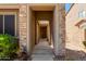Exterior entrance shows stone facade and sheltered entry to front door at 29374 N 68Th Ln, Peoria, AZ 85383