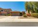 Charming single-story home featuring desert landscaping and a well-manicured front yard at 29374 N 68Th Ln, Peoria, AZ 85383