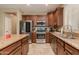 Well-equipped kitchen with stainless steel appliances, granite countertops, and ample cabinet space at 29374 N 68Th Ln, Peoria, AZ 85383