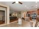Open floor plan with kitchen featuring stainless steel appliances and center island adjacent to the living room at 29374 N 68Th Ln, Peoria, AZ 85383