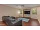 Comfortable living room featuring stylish leather furniture and abundant natural light at 29374 N 68Th Ln, Peoria, AZ 85383