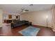 Spacious living room showcases wood floors, ceiling fan, and open concept design at 29374 N 68Th Ln, Peoria, AZ 85383