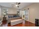 Comfortable main bedroom with wood floors, sliding glass door to main bathroom, and plenty of natural light at 29374 N 68Th Ln, Peoria, AZ 85383