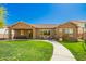 Beautiful home exterior showcasing a well-manicured lawn and inviting patio areas for outdoor living at 3046 E Athena Ave, Gilbert, AZ 85297