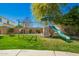 Backyard playset on green lawn, perfect for outdoor fun and games at 3046 E Athena Ave, Gilbert, AZ 85297