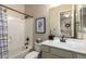 Bright bathroom features a clean white vanity, neutral walls, and a tub/shower combination at 3046 E Athena Ave, Gilbert, AZ 85297
