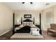 Spacious bedroom featuring a luxurious four-poster bed and neutral color palette at 3046 E Athena Ave, Gilbert, AZ 85297