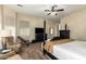 Bedroom with a bed, dresser, chair, fan, mirror, and workout equipment at 3046 E Athena Ave, Gilbert, AZ 85297