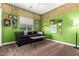Decorated room with lots of posters, and green walls at 3046 E Athena Ave, Gilbert, AZ 85297