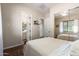 Bright primary bedroom with a mirrored closet, natural light, and a connecting bathroom at 3046 E Athena Ave, Gilbert, AZ 85297