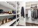 Walk-in closet with ample shelving and hanging space for organized storage at 3046 E Athena Ave, Gilbert, AZ 85297