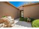 Inviting entry courtyard with comfortable seating and lush greenery at 3046 E Athena Ave, Gilbert, AZ 85297