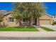 Charming home featuring well-maintained landscaping, a two-car garage, and a welcoming front entrance at 3046 E Athena Ave, Gilbert, AZ 85297