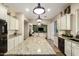 Kitchen showcasing granite countertops, white cabinets, and stainless steel appliances at 3046 E Athena Ave, Gilbert, AZ 85297