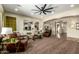 Open-concept living room with arched doorways, neutral tones, and a comfortable seating area at 3046 E Athena Ave, Gilbert, AZ 85297