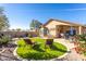 Inviting backyard featuring artificial grass, patio furniture, and a well-maintained landscape, ideal for outdoor relaxation and entertainment at 31013 N Claridge Cir, San Tan Valley, AZ 85143