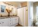 Bright bathroom with double vanity, granite countertops, and a tiled walk-in shower for a luxurious and modern feel at 31013 N Claridge Cir, San Tan Valley, AZ 85143